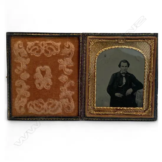 Gilt matted ambrotype – seated man